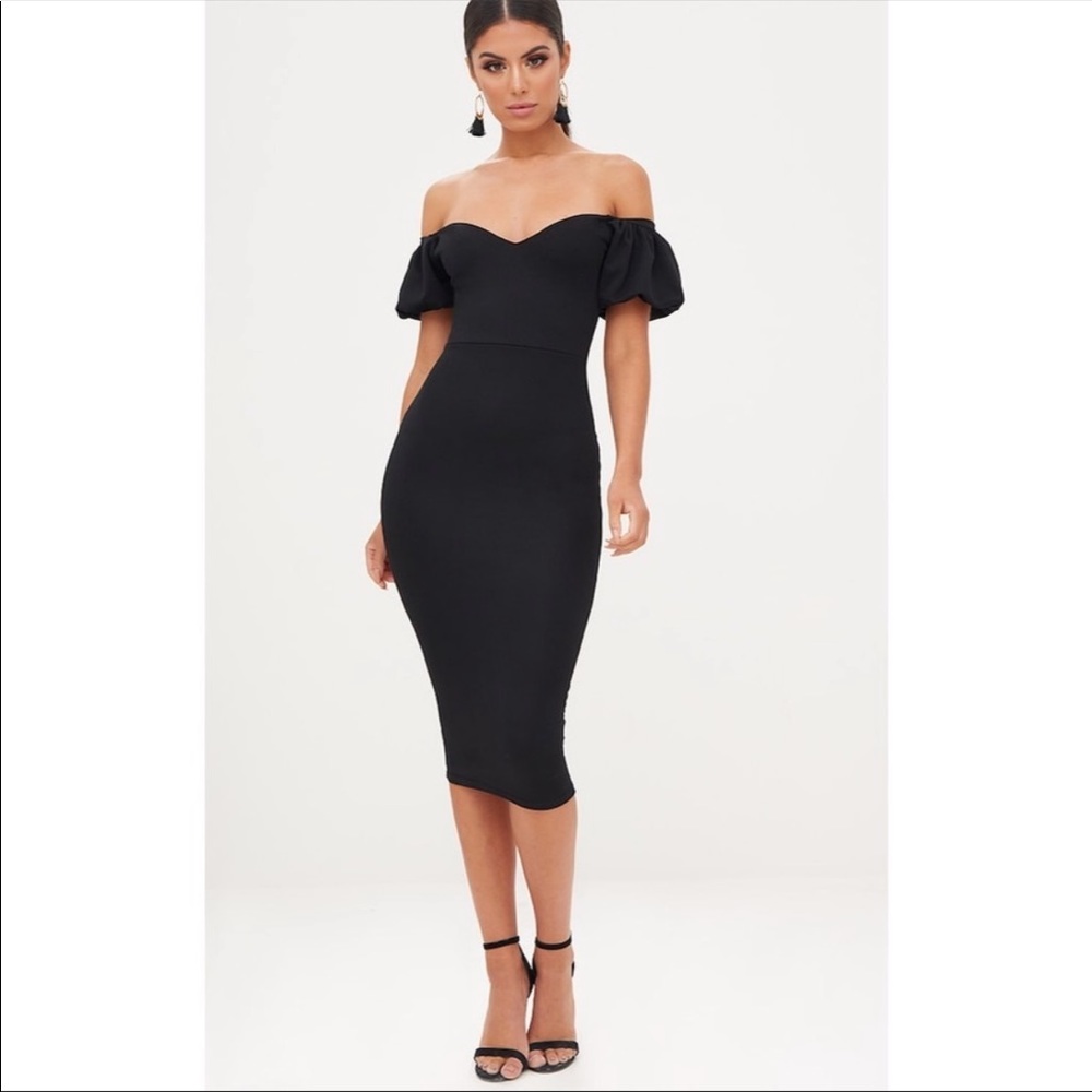 Size 4 worn once. Black off shoulder midi dress